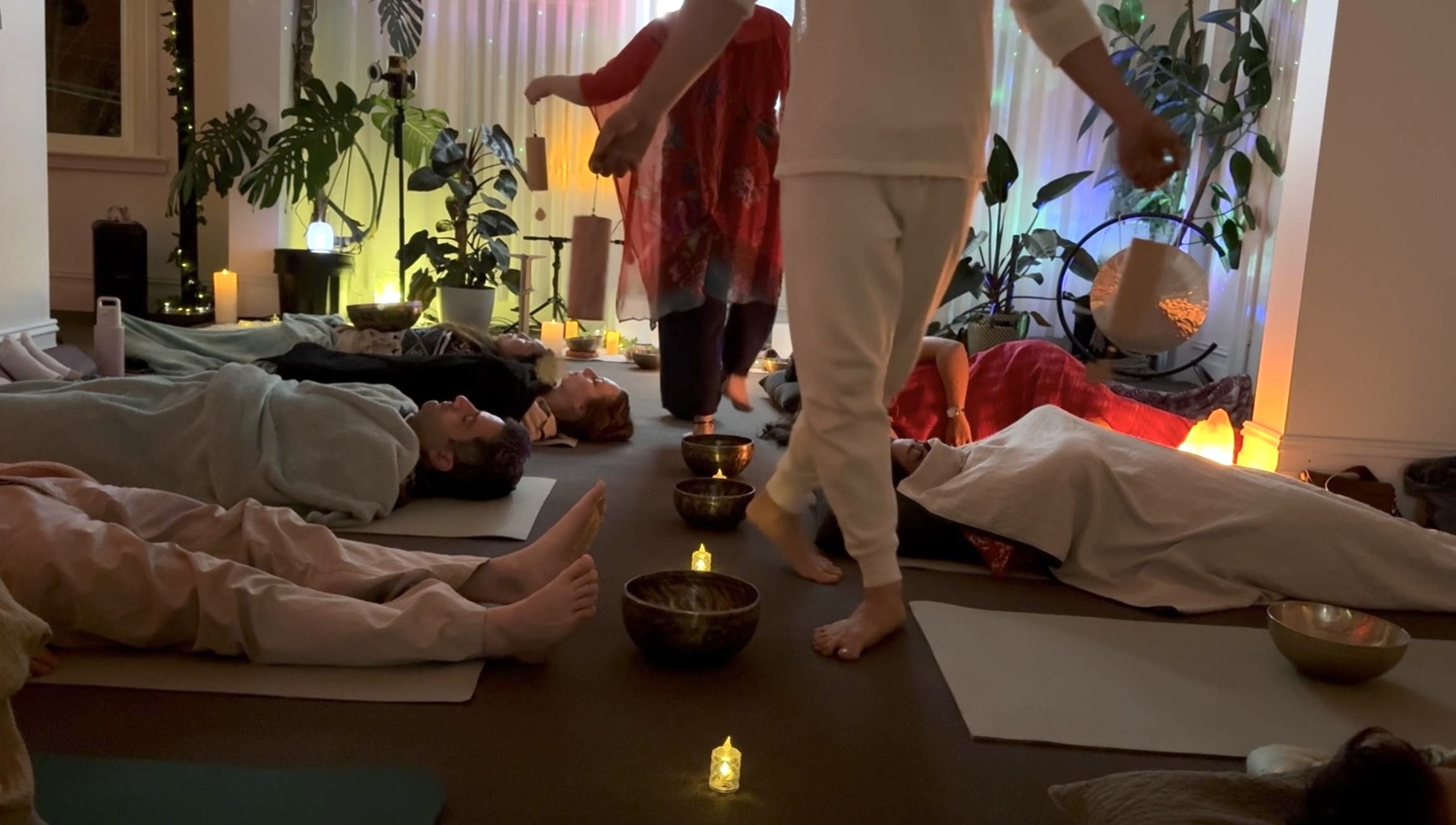 Phoenix and Katrina moving through bowls and resting guests at Mystic Wellness
