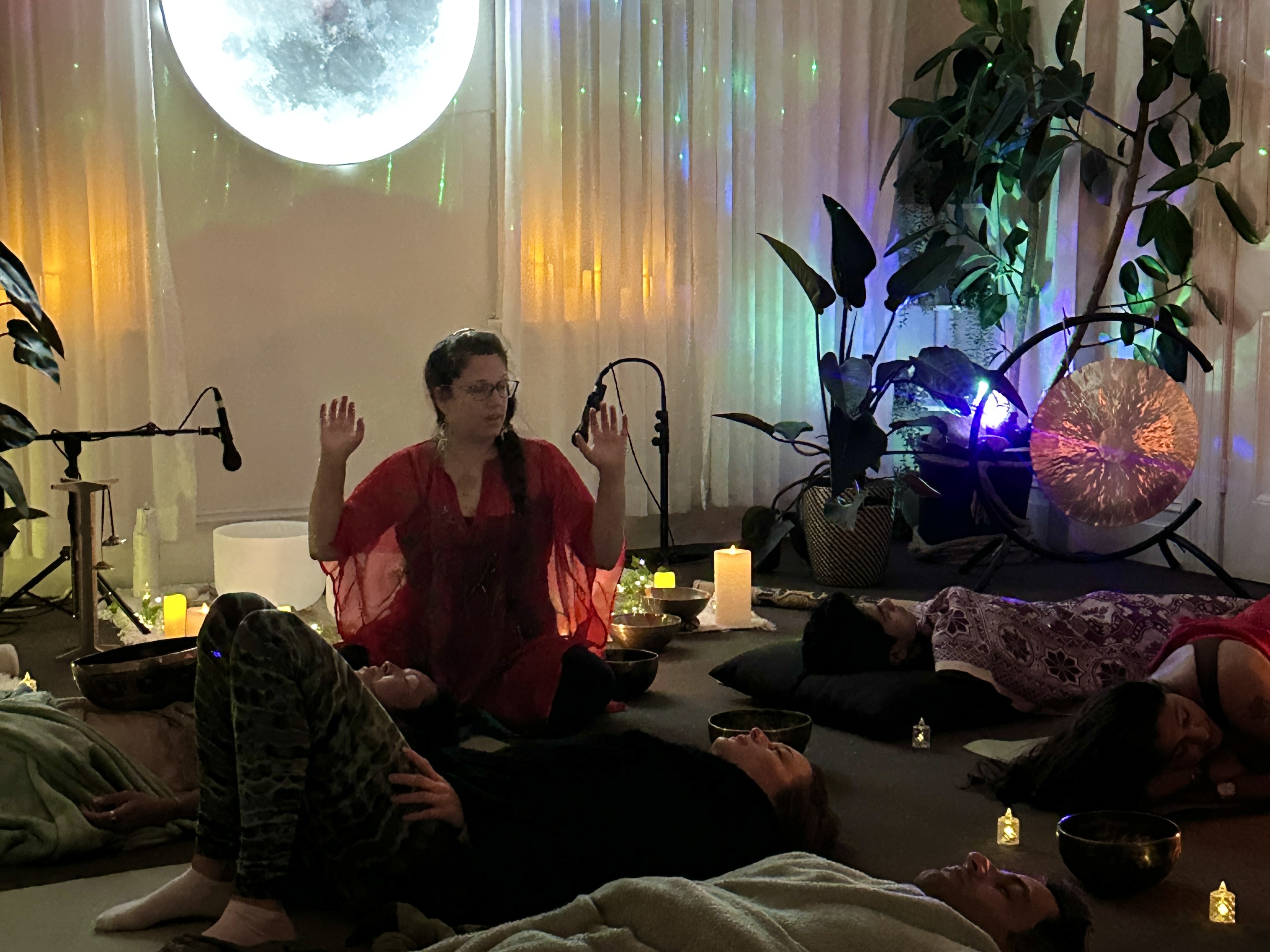 Katrina Noela guiding guests through a somatic rest practice at Mystic Wellness