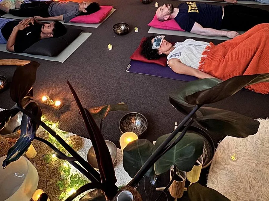 Community session with people resting at Mystic Wellness